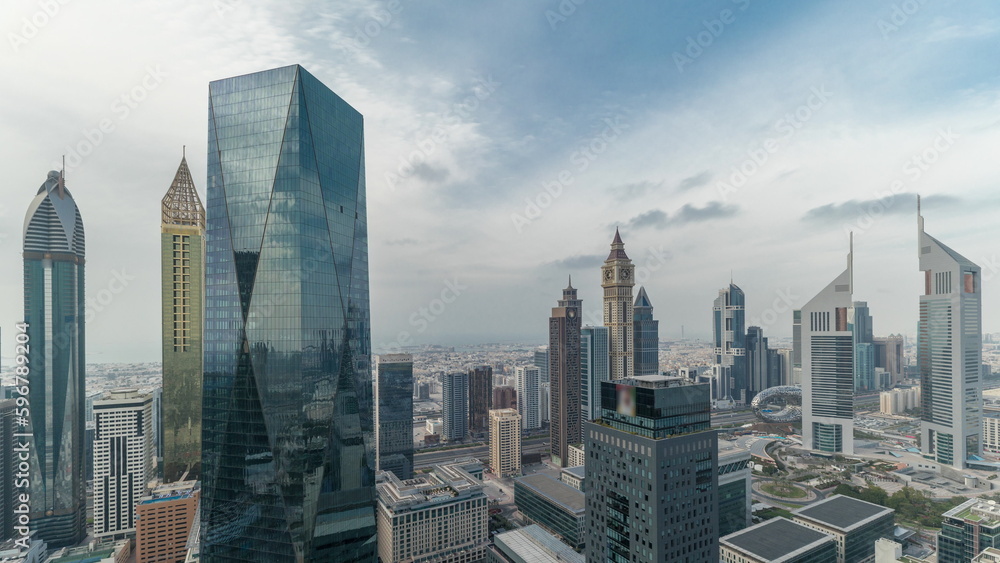 Obraz premium Panorama of futuristic skyscrapers in financial district business center in Dubai on Sheikh Zayed road timelapse