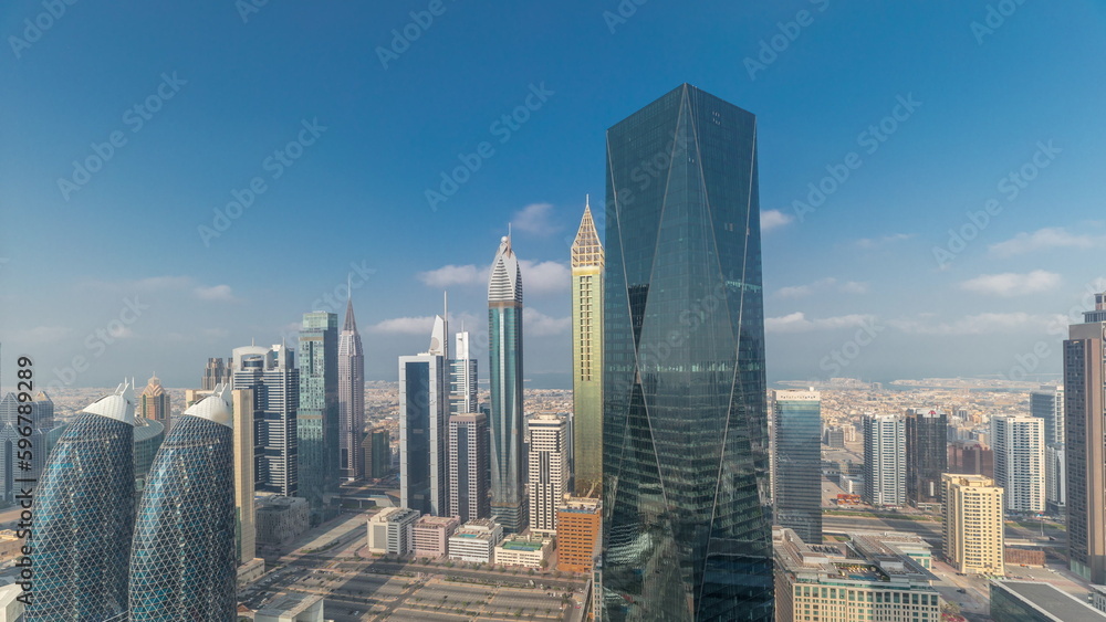 Fototapeta premium Panorama of futuristic skyscrapers in financial district business center in Dubai on Sheikh Zayed road timelapse