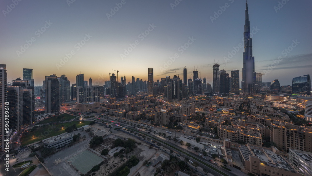 Obraz premium Dubai Downtown day to night transition timelapse with tallest skyscraper and other towers
