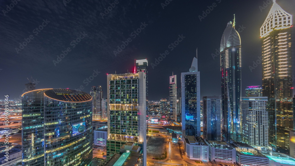 Fototapeta premium Dubai international financial center skyscrapers aerial night timelapse.