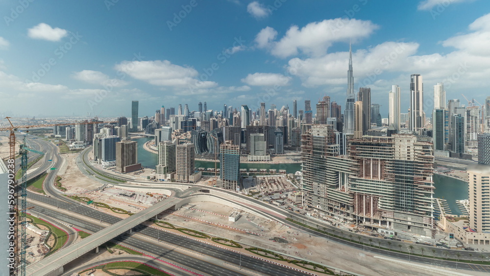 Panorama showing skyline of Dubai with business bay and downtown district timelapse.