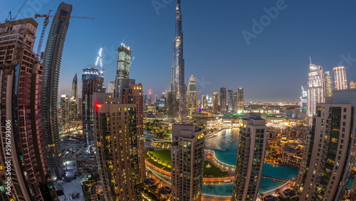 Dubai Downtown cityscape with tallest skyscrapers around aerial day to night timelapse. © neiezhmakov