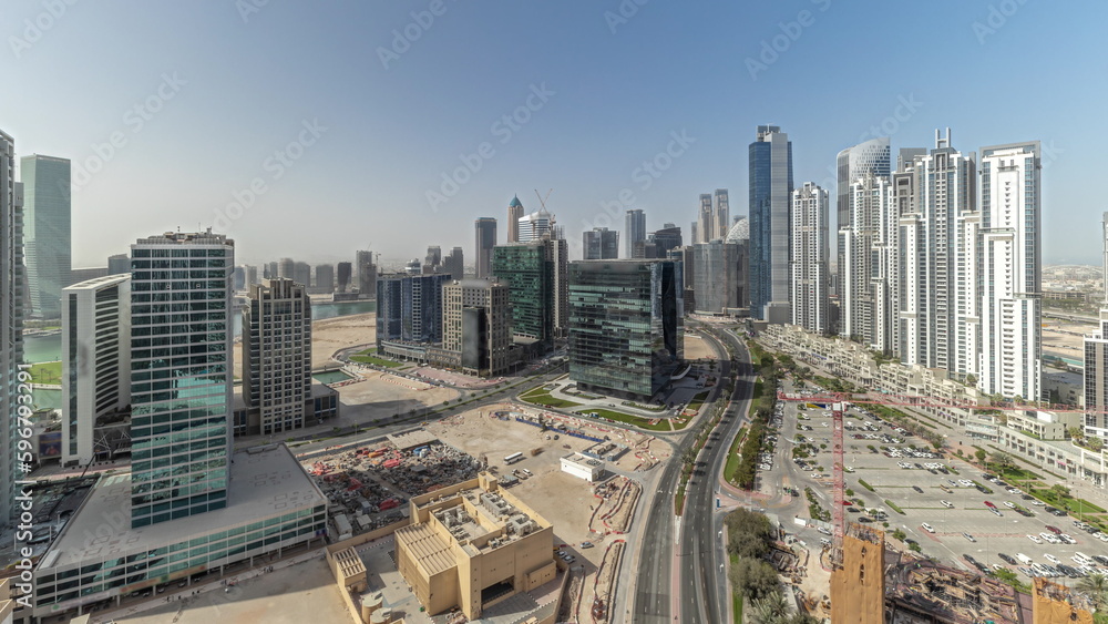 Fototapeta premium Panorama showing Bay Avenue with modern towers residential development in Business Bay aerial timelapse, Dubai