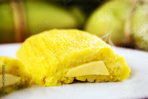 pamonha, Brazilian sweet made from homemade cheese with corn. Open pissing ready for consumption. Concept of traditional Brazilian sweet, typical food of the June festivities
