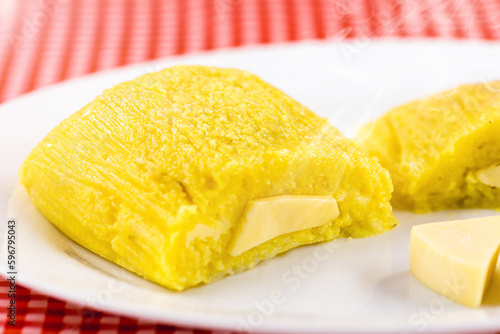 Pamonha, Brazilian sweet corn with cheese filling. Pamonha typical of Brazil, food of the state of minas gerais and goiais. , typical food of the June festivities photo