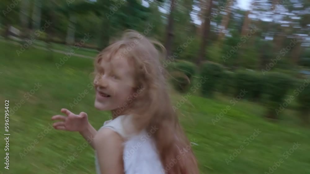 The girl angel playfully runs and playfully flirts. She runs among the trees. The girl angel playfully runs and playfully flirts. She runs among the trees.