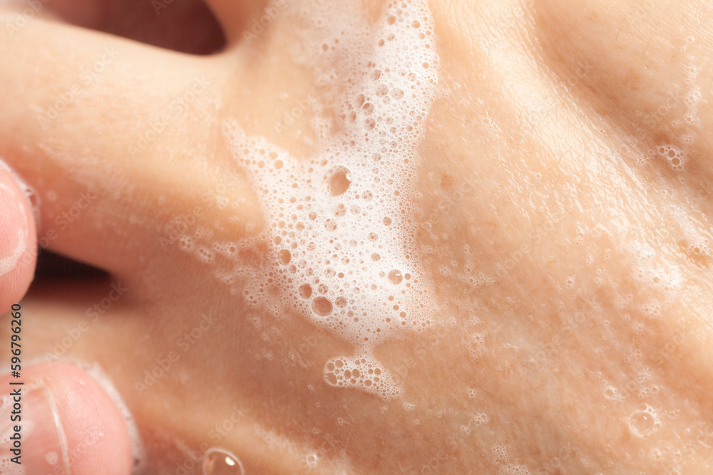 Fototapeta premium Washing men's hands with soap. Personal hygiene concept, hand washing.
