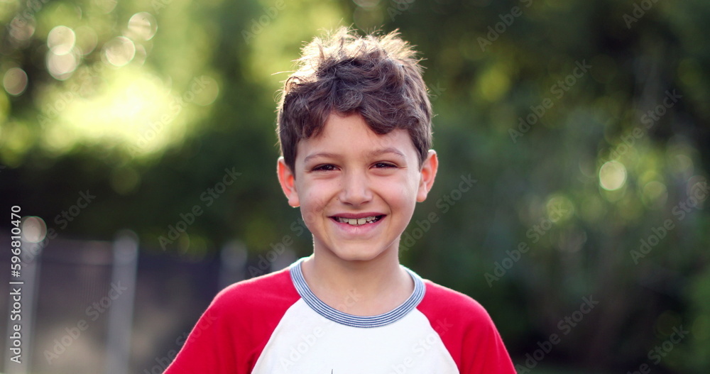 Happy child boy smiling waving hello to camera. Joyful kid face expression Happy child boy smiling waving hello to camera. Joyful kid face expression