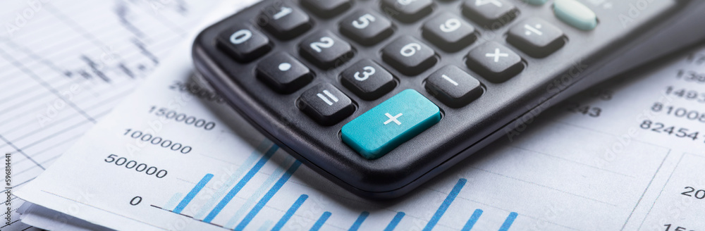 calculator and accounting document. Concept of banking, financial report and financial audit. calculator and accounting document. Concept of banking, financial report and financial audit.
