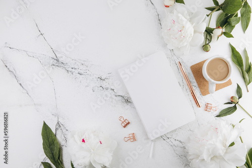 Women's marble table, diary mockup white peonies and coffee around, flat lay