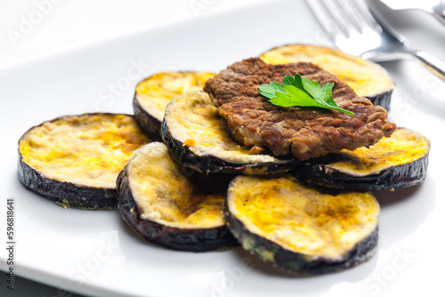 meat in breadcrumbs with grilled aubergine