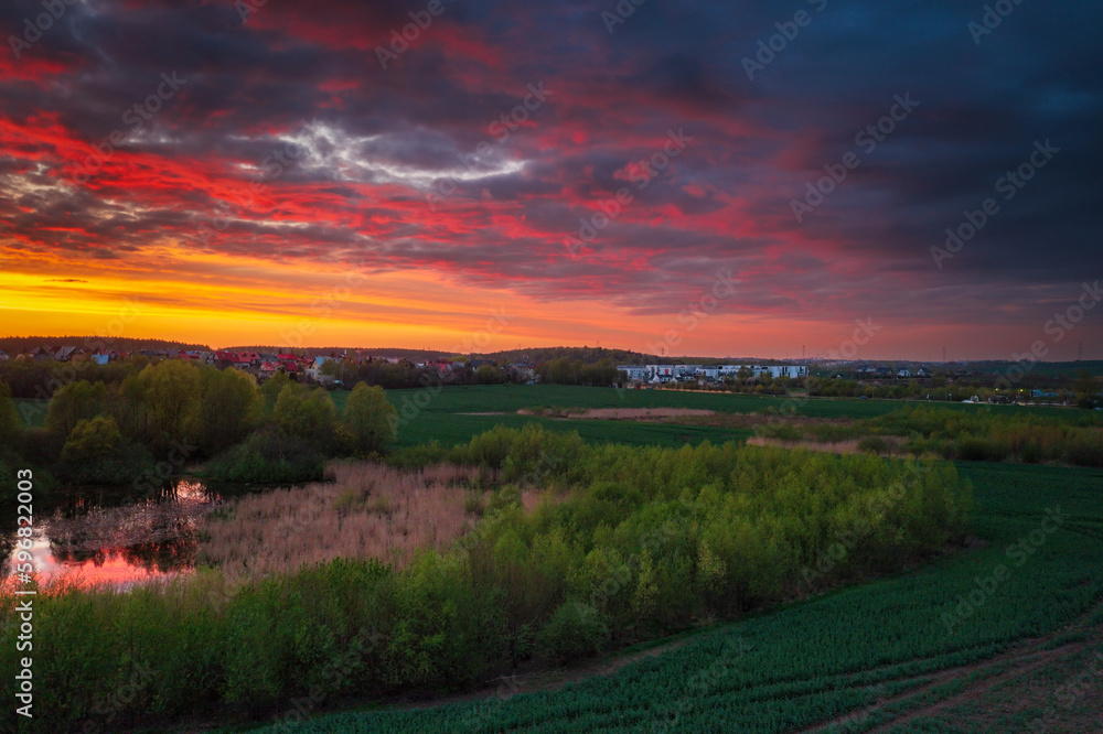 Fototapeta premium Amazing sunset over the spring fields of Rotmanka, Poland