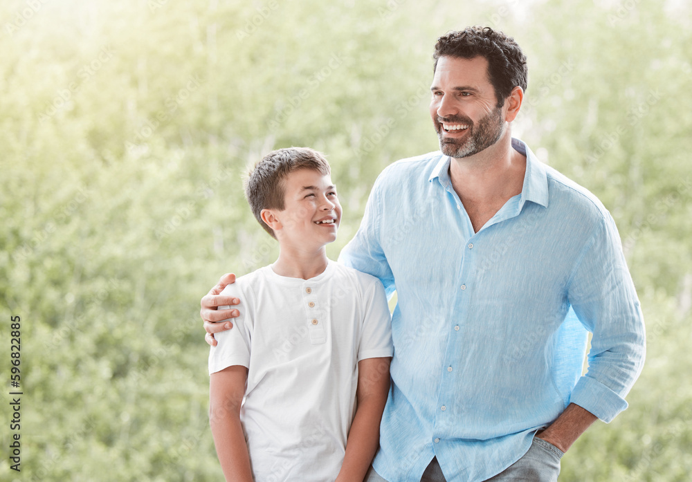 Hes my role model. Shot of a father and son spending time together outside in the garden at home.