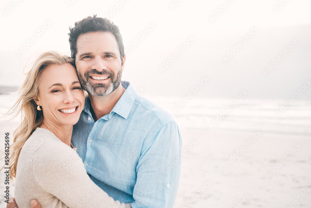 Fototapeta premium Howd I get so lucky. Shot of a mature couple spending a day at the beach.