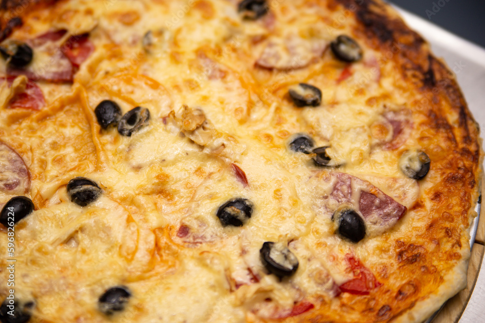 Pizza with olives pepper and cheese. Pizza with olives pepper and cheese.