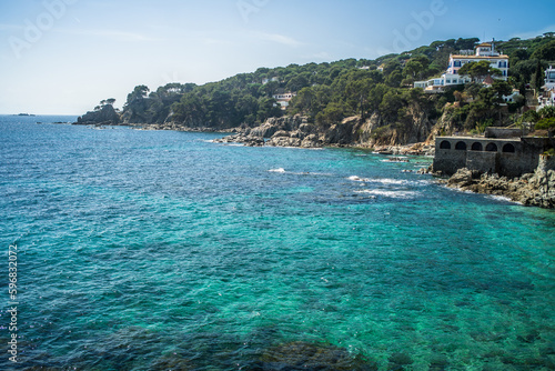 A classic white town on the Costa Brava. White houses, historical buildings of Calella de Palafrugell. Rocks, beach and sea view
