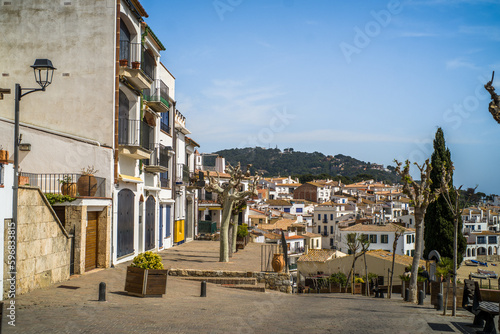 A classic white town on the Costa Brava. White houses, historical buildings of Calella de Palafrugell. Rocks, beach and sea view