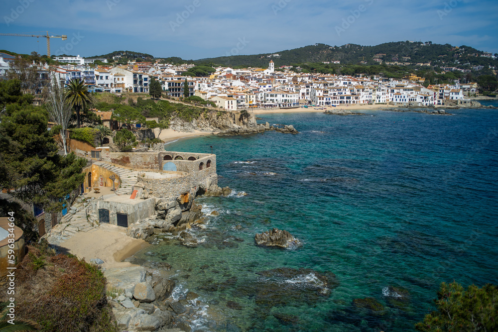 A classic white town on the Costa Brava. White houses, historical buildings of Calella de Palafrugell. Rocks, beach and sea view