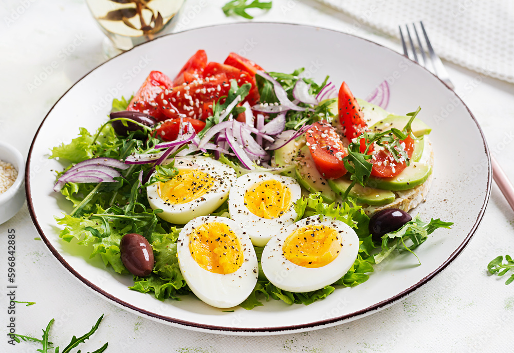 Fresh salad with tomato, olives, boiled eggs and and sandwich with ricotta cheese, avocado. Fresh salad with tomato, olives, boiled eggs and and sandwich with ricotta cheese, avocado.