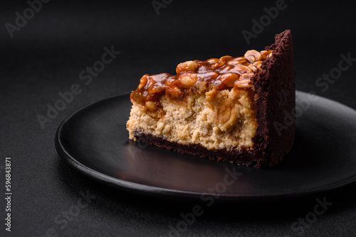 Delicious fresh cheesecake cake or snickers with cream and nuts photo