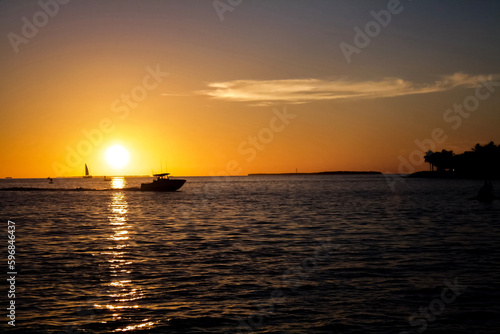 sunset over the sea with boat