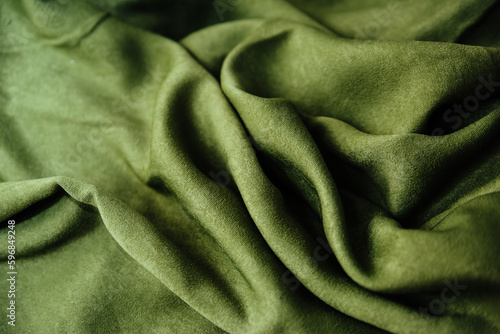 The texture of the green velvet fabric. Textile
