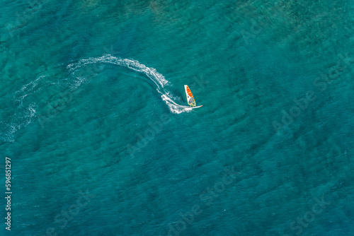 Wind surfer Kauai Napali Coast aerial view from Helicopter tour, golden hour © Zachary