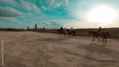 Group of tourists during horse riding tour in Goreme, Cappadocia, Turkey.