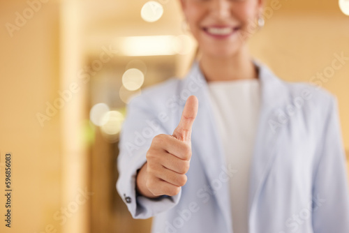 Keep at it with all your efforts. Closeup shot of an unrecognisable businesswoman showing thumbs up in an offce.