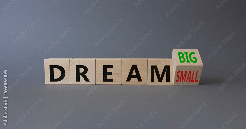 Dream Big vs Small symbol. Wooden cubes with words Dream Small and Dream Big. Beautiful grey background. Business and Dream concept. Copy space Dream Big vs Small symbol. Wooden cubes with words Dream Small and Dream Big. Beautiful grey background. Business and Dream concept. Copy space