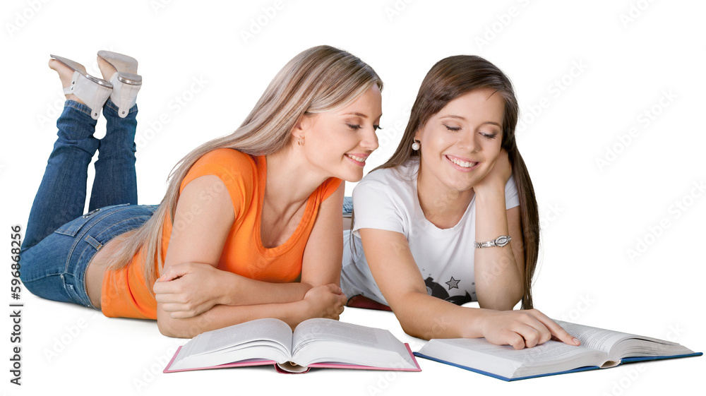 Two girls reading books isolated on white background Two girls reading books isolated on white background