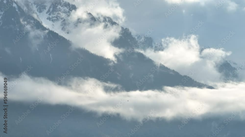 Low clouds in the Swiss Mountains - aerial view by drone Low clouds in the Swiss Mountains - aerial view by drone