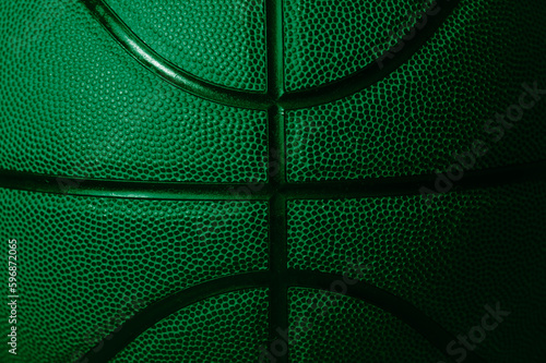 Closeup detail of green basketball ball texture background. Horizontal sport theme poster, greeting cards, headers, website and app © Augustas Cetkauskas