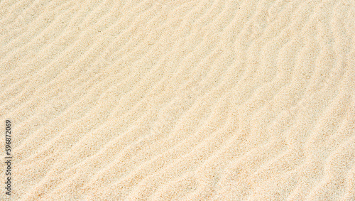Sand Texture. Brown sand. Background from fine sand. Sand background. Horizontal creative theme poster, greeting cards, headers, website and app
