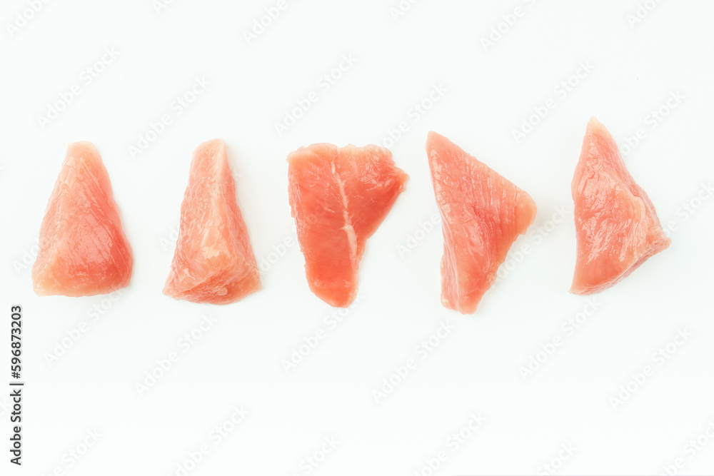Fresh frozen pieces of turkey meat on a white background.Raw chicken.Frozen chicken fillet.Ogranic food and healthy eating.frozen turkey or poultry meat.Chicken Skewers breast fillet meat