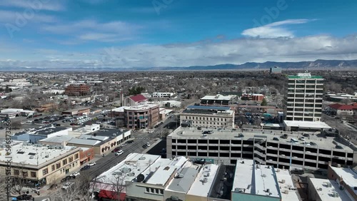 Aerial Union Station train tracks Grand Junction Colorado fast 4K. Urban interstate highway and railroad transportation. Historic business, homes and architecture. City center, cityscape, station.