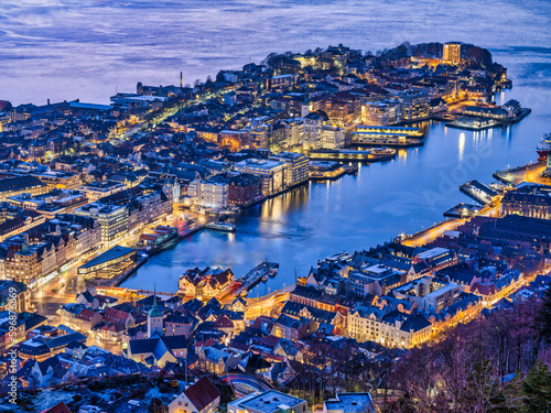 Bergen city illiminated with golden street and buildings lights on a winter evening, Norway photo