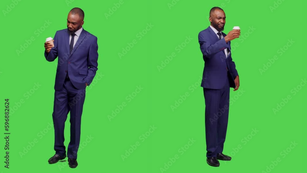 Company manager in office suit serving coffee cup, holding caffeine refreshment and posing over full body greenscreen. Young businessman drinking hot beverage, feeling confident. Company manager in office suit serving coffee cup, holding caffeine refreshment and posing over full body greenscreen. Young businessman drinking hot beverage, feeling confident.