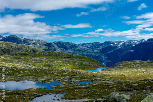 Beautiful blue ponds in the hiking trail of Trolltunga, Odda, Norway