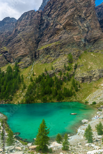 Fototapeta Naklejka Na Ścianę i Meble -  The crystal clear water of the Blue Lake of Ayes,  Italian Alps