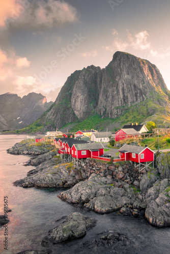 Beautiful sunrise over Hamnoy, fishermen village with the typical red houses of the Lofoten Islands , Norway