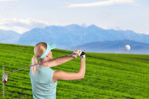 Golfer sporty person hitting ball