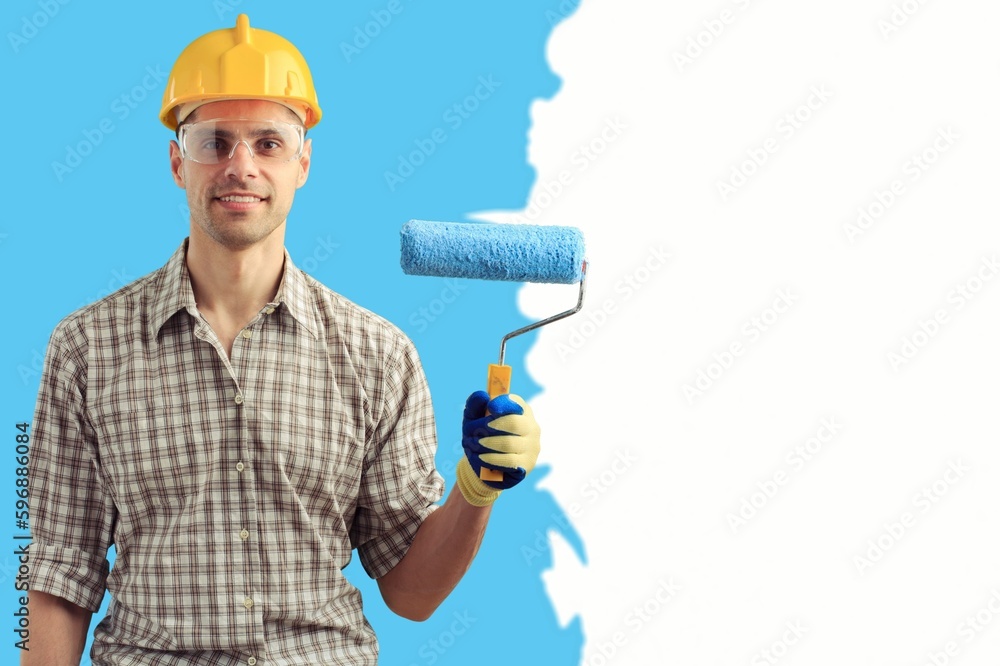 Home renovation concept, person painting an interior Home renovation concept, person painting an interior