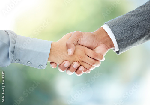 Weve got just the position for you. Cropped shot of two unrecognizable businesspeople shaking hands in an office.