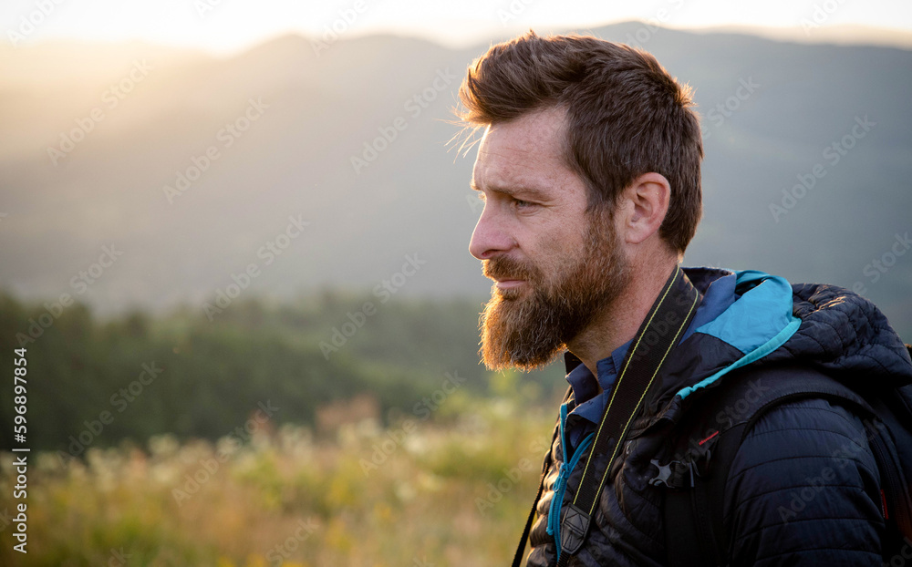 male photographer in nature at sunset