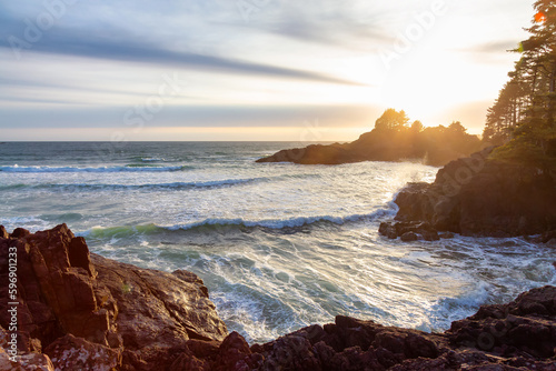 Rocky Shore on West Coast of Pacific Ocean in Tofino. Cox Bay in Vancouver Island, British Columbia, Canada. Sunset Sky.