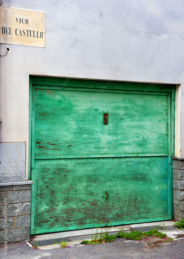 characteristic historic wooden door in millesimo savona italy