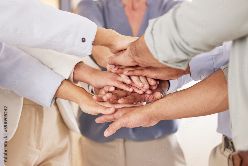 We can only achieve big results if we all stand together. Closeup shot of a group of unrecognisable businesspeople joining their hands together in a huddle in an office. We can only achieve big results if we all stand together. Closeup shot of a group of unrecognisable businesspeople joining their hands together in a huddle in an office.