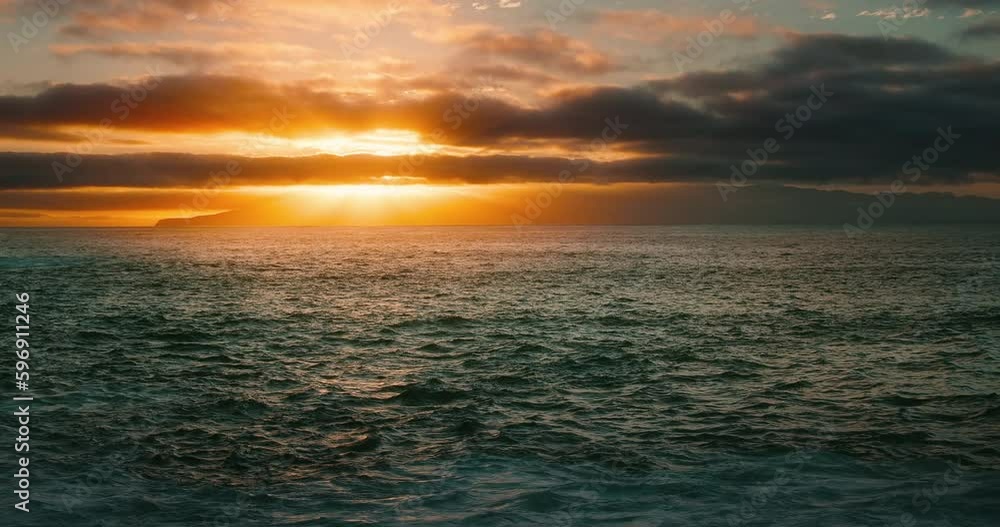 Dramatic sunset storm clouds with sun rays over the ocean. Evening orange overcast sky. Endless sea horizon. Dramatic sunset storm clouds with sun rays over the ocean. Evening orange overcast sky. Endless sea horizon.