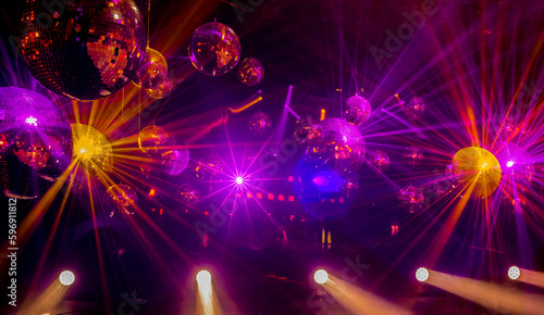disco music show background with disco balls and colorful rays